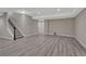 Basement living space with finished stairs and durable wood-look flooring, ready for relaxation or entertainment at 7646 Greenwater Cir, Castle Rock, CO 80108