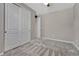 Spacious bedroom featuring new gray carpet, a ceiling fan, and a closet at 7646 Greenwater Cir, Castle Rock, CO 80108