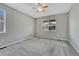 Spacious bedroom with neutral carpet, ceiling fan and natural light coming in through the window at 7646 Greenwater Cir, Castle Rock, CO 80108