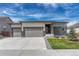 Charming home exterior with a stone facade and a 3 car garage at 7646 Greenwater Cir, Castle Rock, CO 80108
