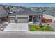 Charming single Gathering home featuring a three-car garage, neutral siding, stone accents, and a beautifully landscaped front yard at 7646 Greenwater Cir, Castle Rock, CO 80108