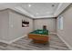 Entertainment-ready game room features wood-look flooring, recessed lighting, and a well-appointed pool table, ready for recreation at 7646 Greenwater Cir, Castle Rock, CO 80108