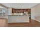 Bright open kitchen features a large island with seating and modern appliances at 7646 Greenwater Cir, Castle Rock, CO 80108