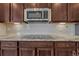 Close up of a kitchen with stainless steel microwave and granite countertops at 7646 Greenwater Cir, Castle Rock, CO 80108