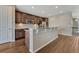 Kitchen with island, stainless appliances, granite countertop and lots of counter seating at 7646 Greenwater Cir, Castle Rock, CO 80108
