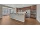 Kitchen featuring a spacious island with granite countertops, stainless appliances and bar seating at 7646 Greenwater Cir, Castle Rock, CO 80108