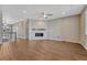 Living room with hardwood flooring, fireplace, and an open floor plan at 7646 Greenwater Cir, Castle Rock, CO 80108