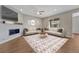Inviting living room with modern fireplace, neutral color palette, and recessed lighting at 7646 Greenwater Cir, Castle Rock, CO 80108