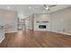 An open floor plan offers hardwood floors and a modern fireplace at 7646 Greenwater Cir, Castle Rock, CO 80108