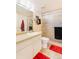 Cozy bathroom featuring a shower with glass doors and a red rug at 13902 E Marina Dr # 111, Aurora, CO 80014