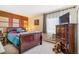 Comfortable bedroom with a spacious dresser, carpeting, and a window at 13902 E Marina Dr # 111, Aurora, CO 80014