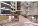 Building entrance with accessible ramp and well-maintained landscaping at 13902 E Marina Dr # 111, Aurora, CO 80014