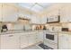 Well-maintained kitchen with white appliances and ample counter space at 13902 E Marina Dr # 111, Aurora, CO 80014