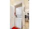 A stacked washer and dryer are tucked away in a closet at 13902 E Marina Dr # 111, Aurora, CO 80014