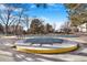 Community pool closed for the season with a winter cover at 13902 E Marina Dr # 111, Aurora, CO 80014