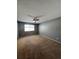 Bedroom features a ceiling fan, window and neutral carpeting at 3610 Morning Glory Dr, Castle Rock, CO 80109