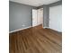 Bedroom with wood floors, two closets, and a neutral paint scheme at 3610 Morning Glory Dr, Castle Rock, CO 80109