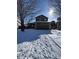 Charming two-story home featuring a two-car garage, a welcoming front porch, and a snow-covered yard at 3610 Morning Glory Dr, Castle Rock, CO 80109
