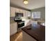 Bright kitchen with white cabinets, stainless steel appliances, and a center island with a dark wood countertop at 3610 Morning Glory Dr, Castle Rock, CO 80109