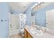 Bright bathroom with a tub/shower combo and modern vanity at 21562 E 47Th Ave, Denver, CO 80249