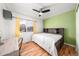 Bedroom with laminate flooring, ceiling fan and a large window at 21562 E 47Th Ave, Denver, CO 80249