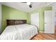 Bedroom featuring ceiling fan, laminate flooring and a closet at 21562 E 47Th Ave, Denver, CO 80249