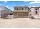 Two-story home with a two-car garage and neutral-colored siding at 21562 E 47Th Ave, Denver, CO 80249