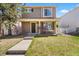 Charming two-story home with front porch, landscaped yard and a well-maintained lawn at 21562 E 47Th Ave, Denver, CO 80249