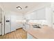 Functional kitchen with white appliances, light countertops, and tile flooring at 21562 E 47Th Ave, Denver, CO 80249