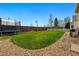 Expansive backyard includes trampoline, well maintained lawn, perfect for outdoor games and relaxation at 14025 Blue River Trl, Broomfield, CO 80023