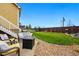 Spacious backyard with a patio, fire pit, seating, and a well-maintained lawn at 14025 Blue River Trl, Broomfield, CO 80023