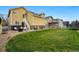 Large backyard with a hot tub, grill, and seating area, perfect for outdoor entertaining at 14025 Blue River Trl, Broomfield, CO 80023