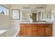 Double sinks and soaker tub are features of this bathroom at 14025 Blue River Trl, Broomfield, CO 80023