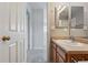 Bathroom with a single sink and access to other rooms, offering convenience and functionality at 14025 Blue River Trl, Broomfield, CO 80023