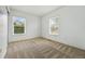 Neutral bedroom with two windows providing natural light and a serene atmosphere at 14025 Blue River Trl, Broomfield, CO 80023