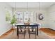 Dining room with large windows, modern lighting, and neutral decor at 14025 Blue River Trl, Broomfield, CO 80023