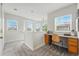 Upstairs landing features multiple windows, built-in desk, and neutral carpet at 14025 Blue River Trl, Broomfield, CO 80023