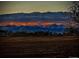 Scenic mountain view with a vibrant sunset adds natural beauty to the landscape at 14025 Blue River Trl, Broomfield, CO 80023