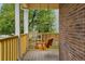 Relaxing porch featuring a wooden swing with views of the front yard at 14025 Blue River Trl, Broomfield, CO 80023