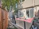Private patio with outdoor seating and barbecue grill, ideal for entertaining or enjoying the outdoors at 4273 W Ponds Cir, Littleton, CO 80123