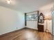 Bright bedroom with wood floors, a large window and a decorative mirror, creating a cozy atmosphere at 4273 W Ponds Cir, Littleton, CO 80123