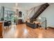 Inviting living room with hardwood floors, natural light, and comfortable seating at 4273 W Ponds Cir, Littleton, CO 80123