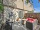 Back patio with an outdoor seating area, grill, and sliding glass doors for easy indoor-outdoor living at 4273 W Ponds Cir, Littleton, CO 80123