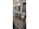 Neutral bathroom features updated vanity with grey cabinets and modern flooring at 5319 Morning Glory Pl, Highlands Ranch, CO 80130