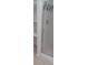 Bathroom featuring a glass-door shower with tile surround and built-in shelves at 5319 Morning Glory Pl, Highlands Ranch, CO 80130