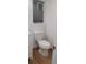 This bathroom features a white toilet, sleek blinds, and neutral walls, creating a clean, comfortable, and functional space at 5319 Morning Glory Pl, Highlands Ranch, CO 80130