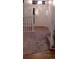 Hallway featuring new carpet, and white railing with dark spindles and new flooring at 5319 Morning Glory Pl, Highlands Ranch, CO 80130