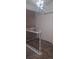 Hallway featuring new carpet, modern light fixture, closet, and white railing with dark spindles at 5319 Morning Glory Pl, Highlands Ranch, CO 80130