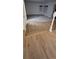 Inviting living space showcasing hardwood floors that transition to carpet, enhanced by natural light through stylish windows at 5319 Morning Glory Pl, Highlands Ranch, CO 80130