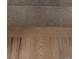 Close-up shot of wood stairs and a carpeted step in a home at 5319 Morning Glory Pl, Highlands Ranch, CO 80130
